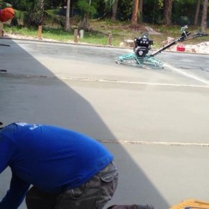 men working on concrete base